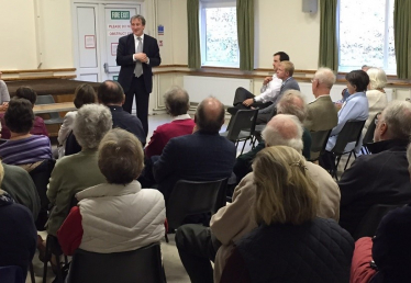 Damian at a public meeting